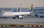 ZS-SXZ @ EGLL - SA A332 towed to parking stand for the day. - by FerryPNL