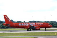 G-EZUI @ EGCC - Colourful arrival - by Clive Pattle