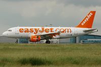 G-EZAL @ LFPG - Airbus A319-111, Reverse thrust landing Rwy 26L, Roissy Charles De Gaulle Airport (LFPG-CDG) - by Yves-Q