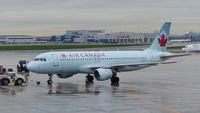 C-FDQV @ CYYZ - Air Canada Airbus A320 on a rainy early morning.