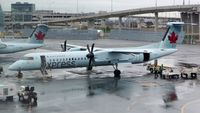 C-GGNZ @ CYYZ - Air Canada Express Dash 8 on a rainy morning.