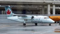 C-GANQ @ CYYZ - Air Canada Express Dash 8 arriving at the terminal. - by M.L. Jacobs