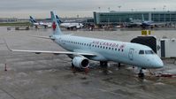 C-FHON @ CYYZ - Air Canada Embraer 190 at the gate on a rainy morning. - by M.L. Jacobs