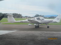 ZK-FIY @ NZFI - shot from rear of hangar through window - by magnaman