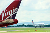 N348AN @ EGCC - Landing at Manchester airport EGCC behind Virgin Airlines B747 G-VROY - by Clive Pattle