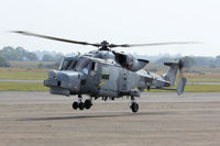 ZZ397 @ EGFH - Royal Navy Wildcat HMA.1, call sign, Talon 704, seen lifting at EGFH following a hot refuel. - by Derek Flewin