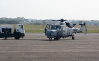 ZZ397 @ EGFH - Visiting Navy Wildcat HMA.2 helicopter operated by AgustaWestland, Yeovil taking on fuel at Swansea Airport.  - by Roger Winser