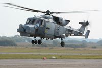 ZZ397 @ EGFH - Visiting Navy Wildcat HMA.2 helicopter operated by AgustaWestland, Yeovil departing Swansea Airport after taking on fuel.  - by Roger Winser