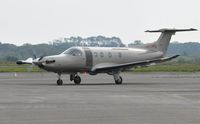 LX-JFM @ EGFH - Jetfly Aviation's PC-12 taxying on apron. - by Roger Winser