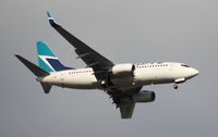 C-GWSP @ MCO - West Jet 737-700 - by Florida Metal