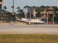 N328FL @ MIA - Phenom 300 - by Florida Metal