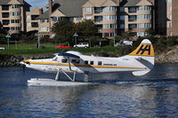C-FIUZ @ CYWH - Taxiing for departure - by Ken Videan