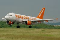 G-EZEV @ LFPG - Airbus A319-111, Landing Rwy 26L, Roissy Charles De Gaulle Airport (LFPG-CDG) - by Yves-Q