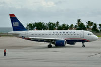 N714US @ TNCM - At the terminal awaiting our departure, which incidentally was delayed for 24 hours because of wind sheer and a torrential thunderstorm. - by kenvidkid
