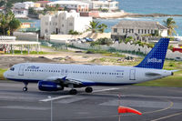 N520JB @ TNCM - As seen from our hotel shortly after our arrival from Paris. - by kenvidkid