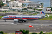 N948AN @ TNCM - Departing St Maarten - by kenvidkid