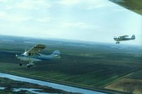 N9069B - 69B with 78E near Stockton,Ca. on the way back to Tracy. Photo plane is Cessna 180 N2935C.