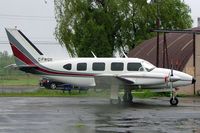 C-FWQX @ CYHU - Piper PA-31-310 Navajo [ 31-92] St. Hubert~C 17/06/2005. Taken from moving coach slight reflection from this  or rain water on the window. - by Ray Barber