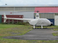 ZK-HXB @ NZAR - On pad by old fuel pump - actually R44 c/n 12669 not R22. - by magnaman