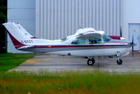 C-GTCT @ CYOW - Cessna T.210R Turbo Centurion [210-64949] Ottawa-Macdonald Cartier International~C 18/06/2005. Taken through glass on coach whilst moving. - by Ray Barber