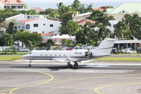 N121JM @ TNCM - N121JM