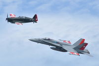 J-5014 @ LSMP - Swiss Air Force F-18C Hornet flying with Morane-Saulnier D-3801 HB-RCF during the AIR14 air show at Payerne Air Base. - by Henk van Capelle