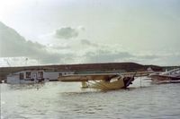 N30472 @ Q59 - One of the many floods at the Fremont airport in Calif. Water receded quickly and was not SF Bay water. 472 was a rental which I flew for an hour or two. That small building was the flight school.Many great flights were made inside it both real & imagined