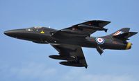 G-FFOX @ EGFH - Flypast by ex-RAF Hawker Hunter T.7A WV318 in the 'Black Arrows' colour scheme carried by 111 Squadron RAF aircraft between 1956 and 1960. Based at Cranfield Airport, Bedfordshire. Recently fitted with two additional underwing fuel tanks. - by Roger Winser
