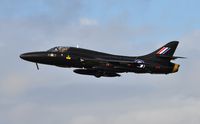 G-FFOX @ EGFH - Hunter T.7A cleaning up after a low pass over Runway 22. Carrying the s/n WV318 and in the 'Black Arrows' colour scheme carried by aircraft of 111 Squadron RAF between 1956 and 1960. Based at Cranfield Airport, Bedfordshire. - by Roger Winser