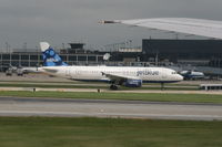 N503JB @ KORD - Taxiing on runway