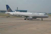 N487UA @ KORD - Arriving to gate
