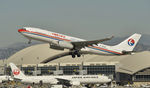 B-5938 @ KLAX - Departing LAX on 25R - by Todd Royer