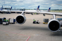 N128UA @ KORD - At the gate O'Hare, engines numbers three and four - by Ronald Barker