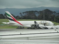 A6-EDO @ NZAA - on apron - taken through glass from observation gallery - by magnaman