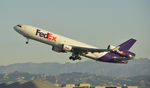N586FE @ KLAX - Departing LAX on 25R - by Todd Royer