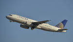 N415UA @ KLAX - Departing LAX on 25R - by Todd Royer