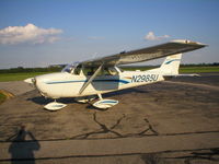N2985U @ KCEV - White with two blue stripes and one gold stripe. Tail number is in blue. - by John Burns