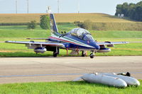 MM55055 @ LSMP - Aermacchi MB339A/PAN #11 of Frecce Tricolori parked at Payerne Air Base, Switzerland (AIR14). Note its droptanks lying in the grass in front. - by Henk van Capelle