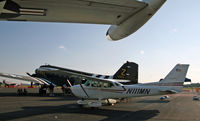 N111MN @ KRDG - A Skyhawk is framed by two warbirds during the 2009 MAAM World War II Weekend. - by Daniel L. Berek