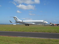 N121RS @ NZAA - Under tow from temporary parking area back to stand prior to departure. - by magnaman