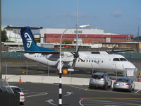 ZK-NFA @ NZAA - from roof of short term car park - by magnaman