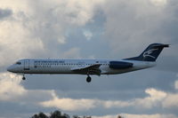4O-AOP @ LMML - Fokker 100 40-AOP Montenegro Airlines - by Raymond Zammit