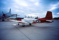 160484 @ CYMJ - T-34C Turbo Mentor 160484 on display at the annual airshow at Canadian Forces Base Moose Jaw, Saskatchewan, Canada in 1987. - by Alf Adams