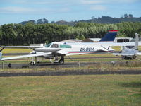 ZK-DEM @ NZAR - taxying between parked planes for aerial survey work - by magnaman