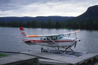 SE-GXT @ N.A. - Cessna TU206 on floats on the river Kamajåkk at Kvikkjokk in Swedish Lappland. - by Henk van Capelle