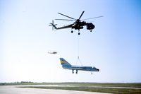 56-0460 @ CYMJ - Being recovered by CH-54 after damage on landing in 1983. - by Alf Adams