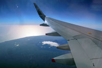 ZK-OXC - The perfectly cone-shaped Mt Taranaki appearing under the wing (CHC-AKL). - by Micha Lueck