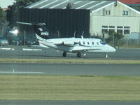 N111CX @ NZWN - Now branded a Nextant 400txi apparently!! Just delivered to new NZ owners - may become ZK-NXJ - time will tell. Photo is long range from terminal through glass. - by magnaman