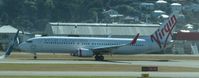 VH-YIL @ NZWN - on take off from a hot wellington. Taken from terminal through glass. - by magnaman