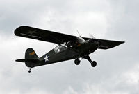 N48620 @ 4N1 - A 1942-vintage liaison aircraft takes off on a dark mission. - by Daniel L. Berek